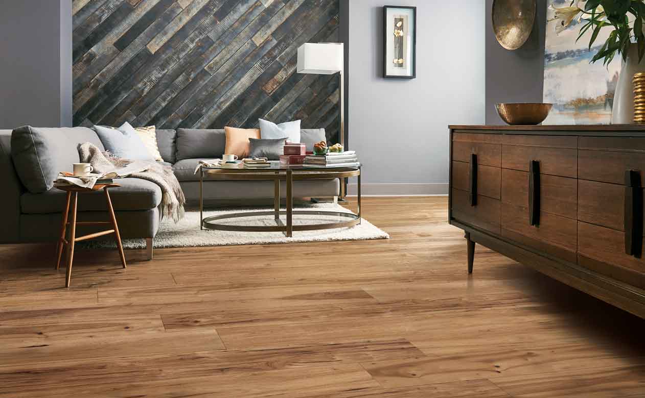 Hardwood Flooring in Bathroom with Tub, Sink, Mirror, and Cabinets